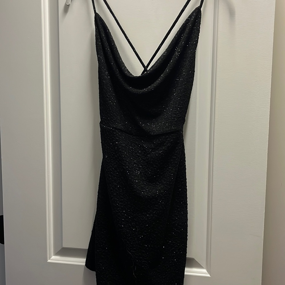 Wore once to homecoming, flattering sparkly scoop neck with strappy back!